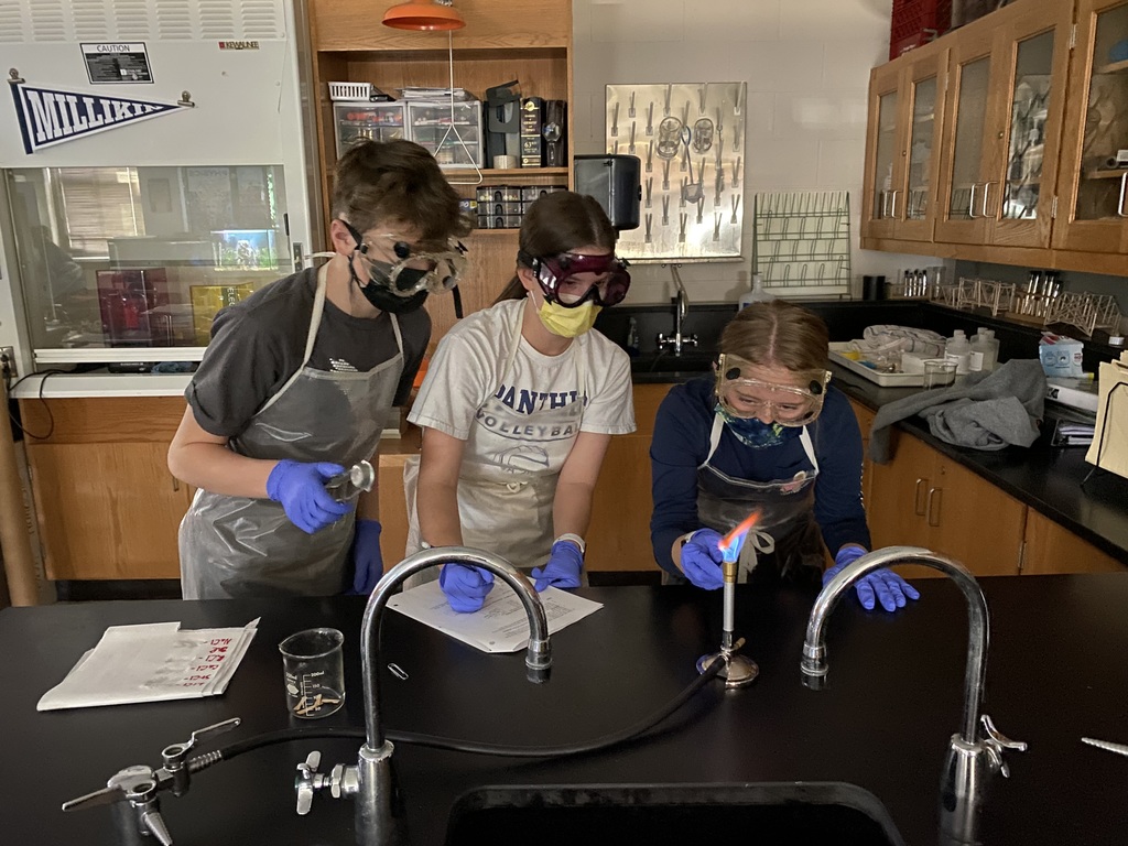 Chemistry students learning how excited electrons can emit photons through flame tests.